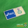 Étiquette extérieure avec logos Asics et ASSE cousue en bas du maillot