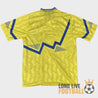 Dos du maillot Everton away 90-91 avec motif éclair bleu sur fond jaune