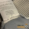 Étiquette intérieure du maillot France 1998 indiquant Made in UK et composition en polyester