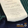 Étiquette intérieure du maillot Newcastle vintage Adidas, indiquant la fabrication au Royaume-Uni et la composition 100% polyester.